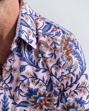 Close-up of a paisley-patterned shirt in pink and indigo.