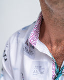 Close-up of a person wearing a white shirt with a patterned collar.