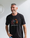 Man wearing a short-sleeved black t-shirt with a colourful John Lennon caricature design