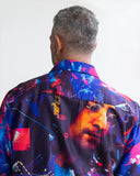 Person wearing a colourful shirt with a John Lennon graphic design